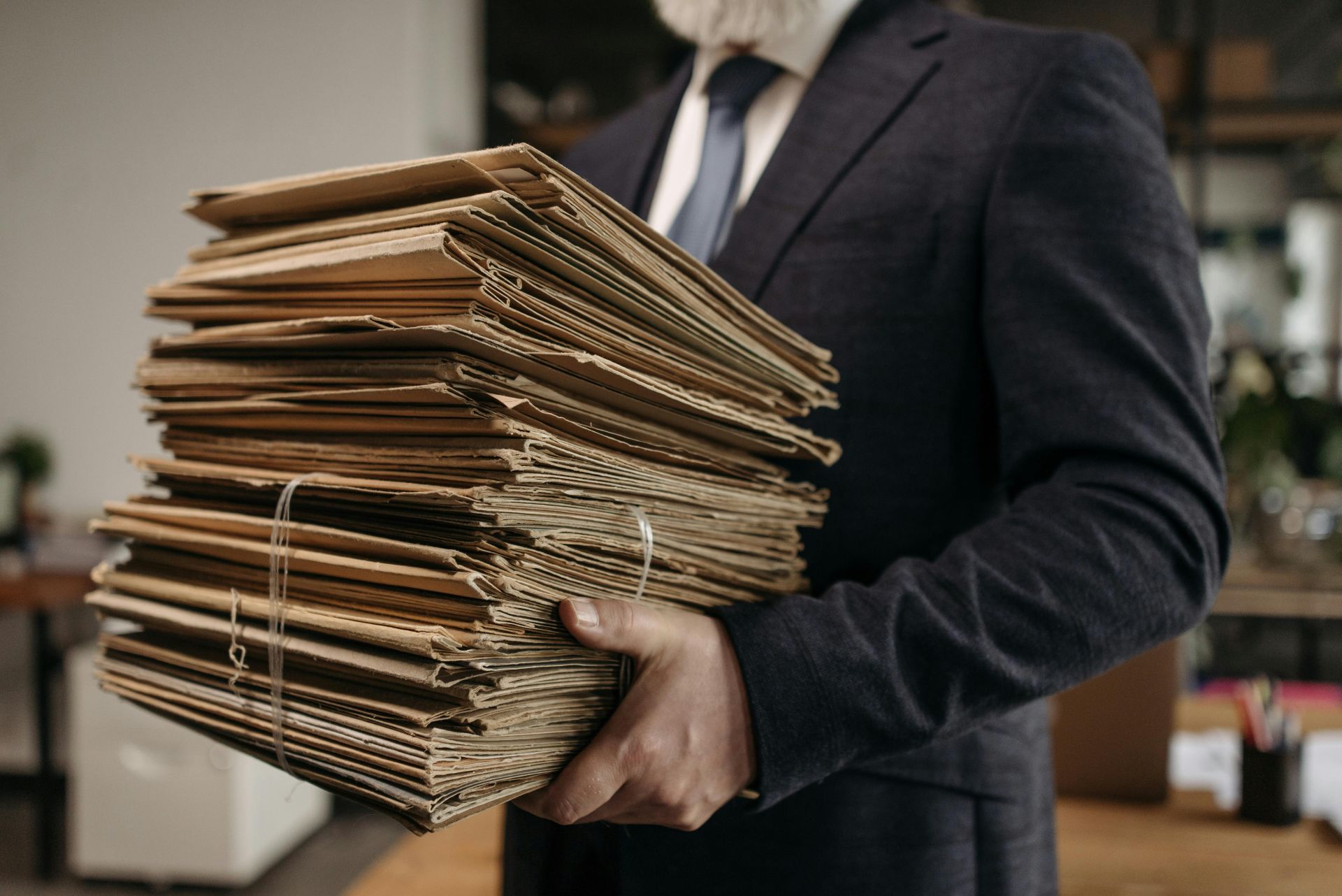 Man Holding Documents Filing